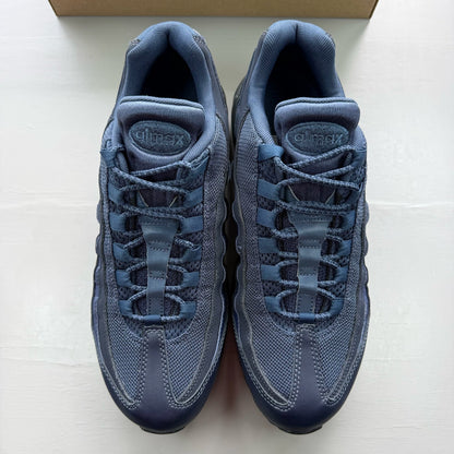 Nike Air Max 95 blue trainers with midnight navy accents and signature logo details.