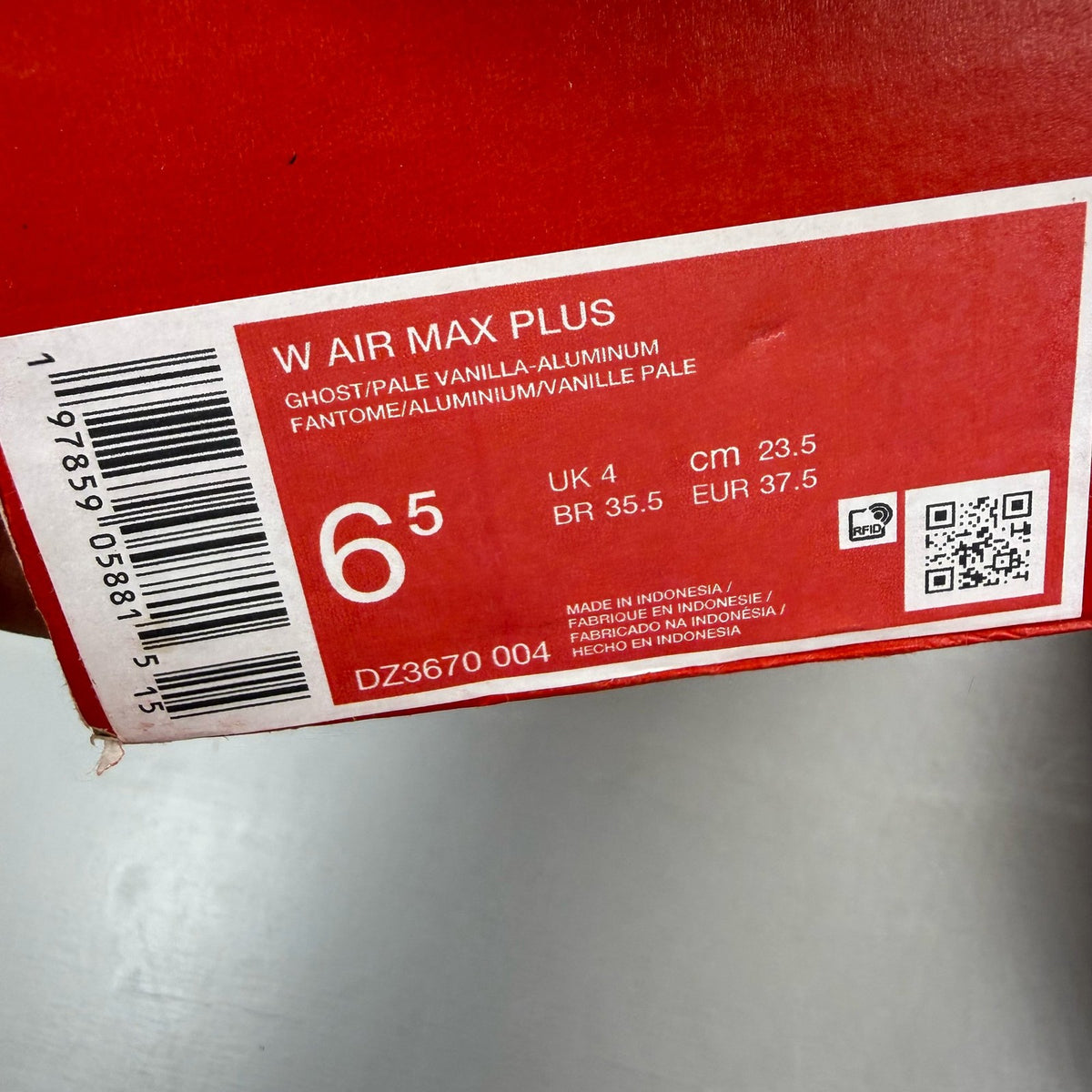 Nike Air Max Plus TN blue trainers with signature logo and sleek design.