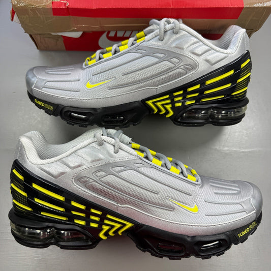 Nike Air Max Plus 3 TN metallic silver with yellow accents and logo details.