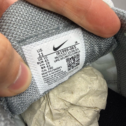 Nike trainers white with cool grey and liquid lime accents, featuring iconic swoosh logo.