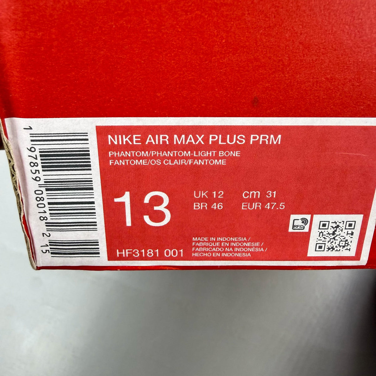 Nike Air Max 95 grey trainers with sundial accents and mesh material.