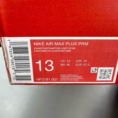 Nike Air Max 95 grey trainers with sundial accents and mesh material.