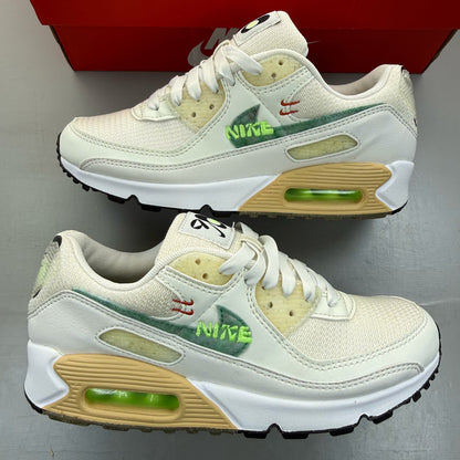 Nike Air Max 90 white trainers with Neptune Green accents and signature logo.