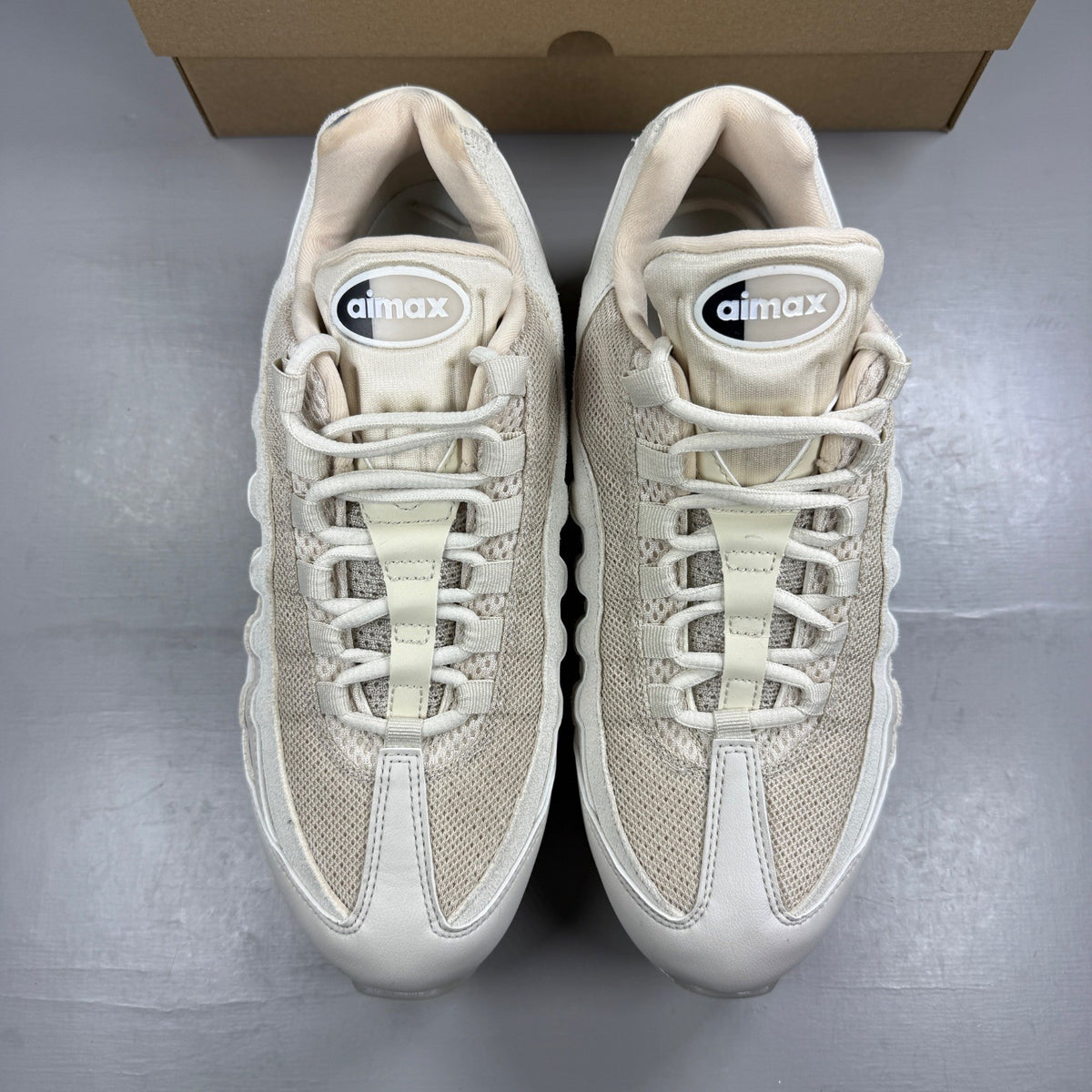 Nike trainers white with big bubble sole and iconic swoosh logo.