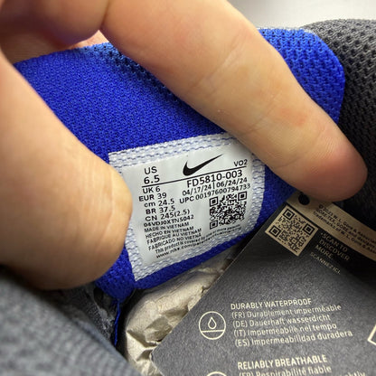 Nike Air Max 90 grey sneakers with Gore-Tex material and blue accents.