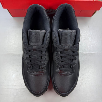 Nike Air Max 90 black leather trainers with logo detailing and textured upper.
