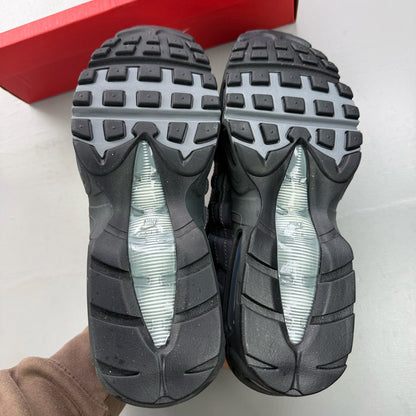 Nike Air Max 95 grey trainers with distinctive design and logo details.