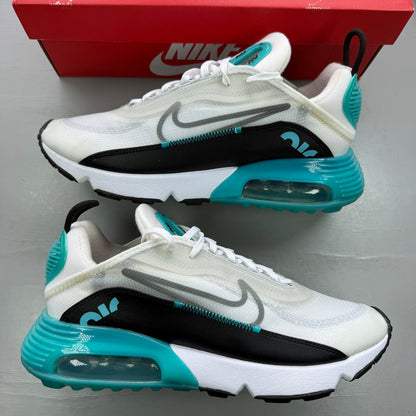 Nike trainers white with black and blue accents, featuring Air Max cushioning and logo.