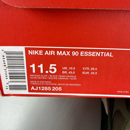 Nike Air Max 90 green trainers with black accents and classic logo detail.