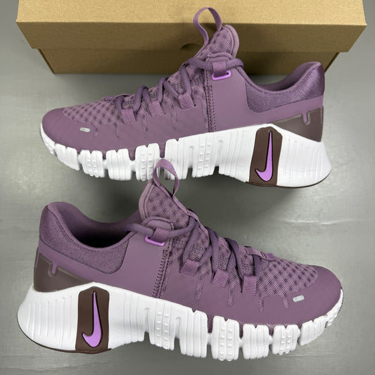 Nike Free Metcon 5 purple trainers with logo and breathable mesh upper.