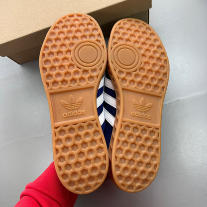 Adidas blue deck shoes suede upper with white logo and gum sole.