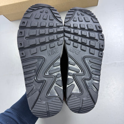 Nike black athletic shoes leather with Air Max logo and triple black design.