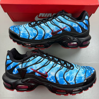 Nike Air Max Plus TN blue trainers with shark attack pattern and iconic swoosh logo.