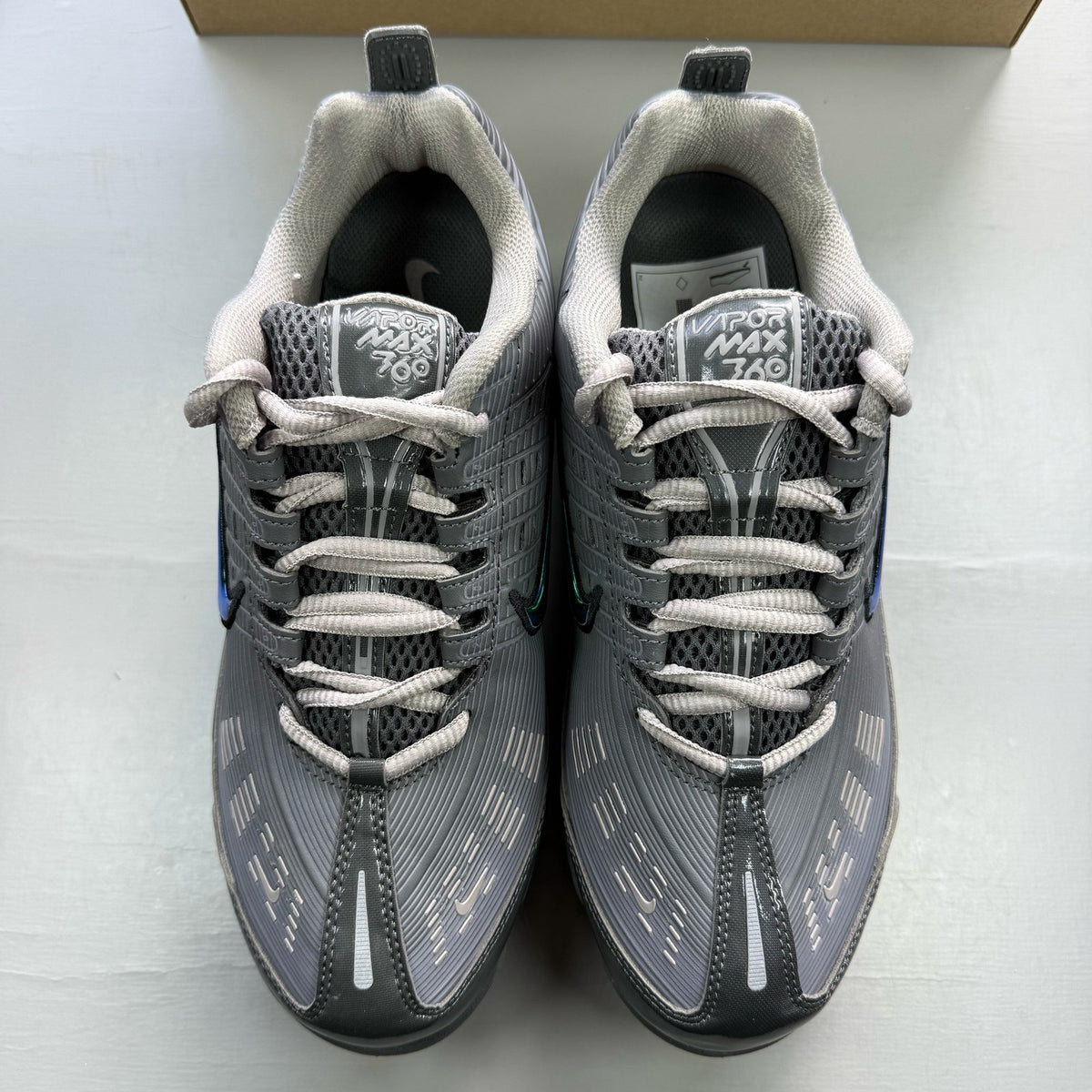 Nike Air VaporMax 360 grey trainers with unique design and textured material.