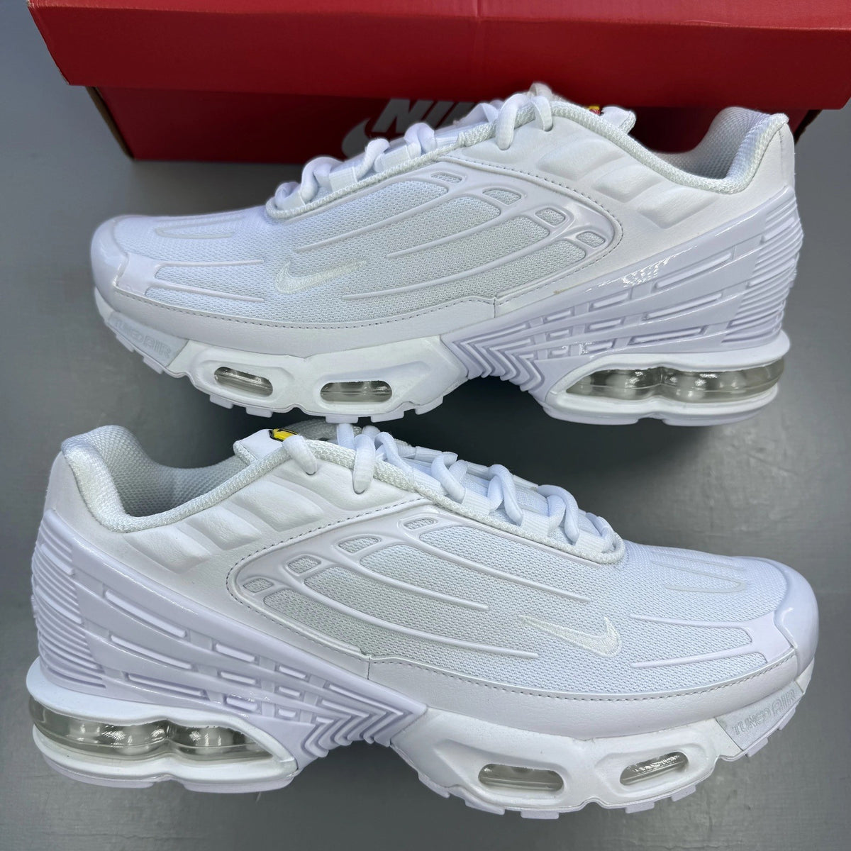 Nike Air Max Plus TN 3 white trainers with logo detailing and mesh upper.