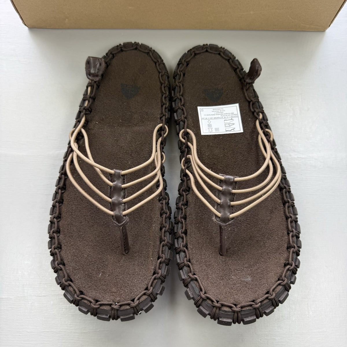 Nike ACG Valkyrie CI slides dark cinder brown with logo detail and textured material.
