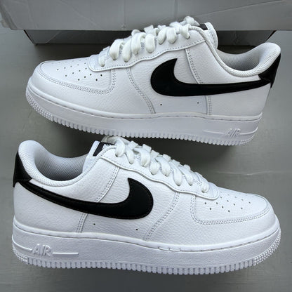Nike Air Force 1 Low trainers white with black swoosh logo and leather upper.