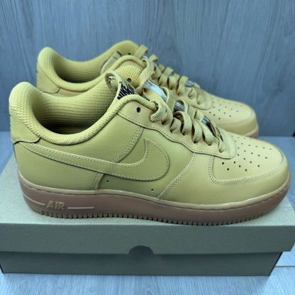 Nike Air Force 1 trainers brown suede upper with gum sole and logo detail.