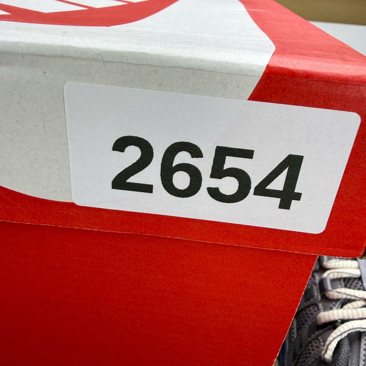 Nike grey blue trainers with pencil point design and logo detail.