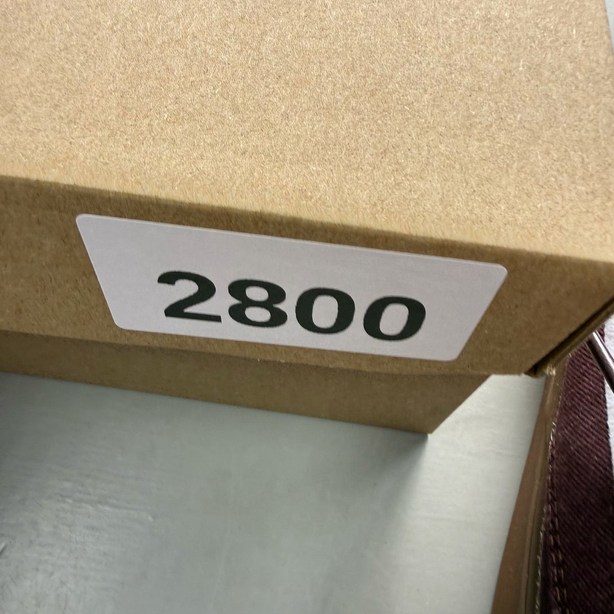 Nike SB Stefan Janoski burgundy trainers with gum sole and white accents.