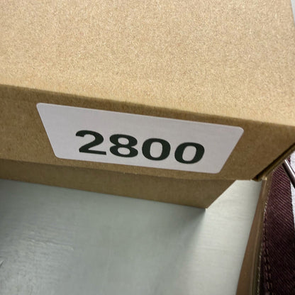 Nike SB Stefan Janoski burgundy trainers with gum sole and white accents.
