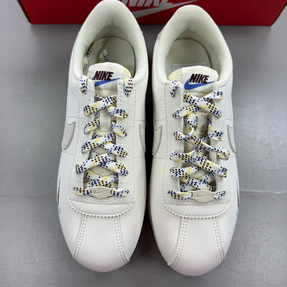 Nike kids trainers white with soft pearl and comet blue accents, classic design.