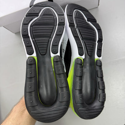 Nike Air Max 270 black trainers with white and volt green accents, mesh material.