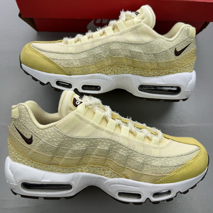 Nike Air Max 95 trainers yellow with textured upper and signature swoosh logo.