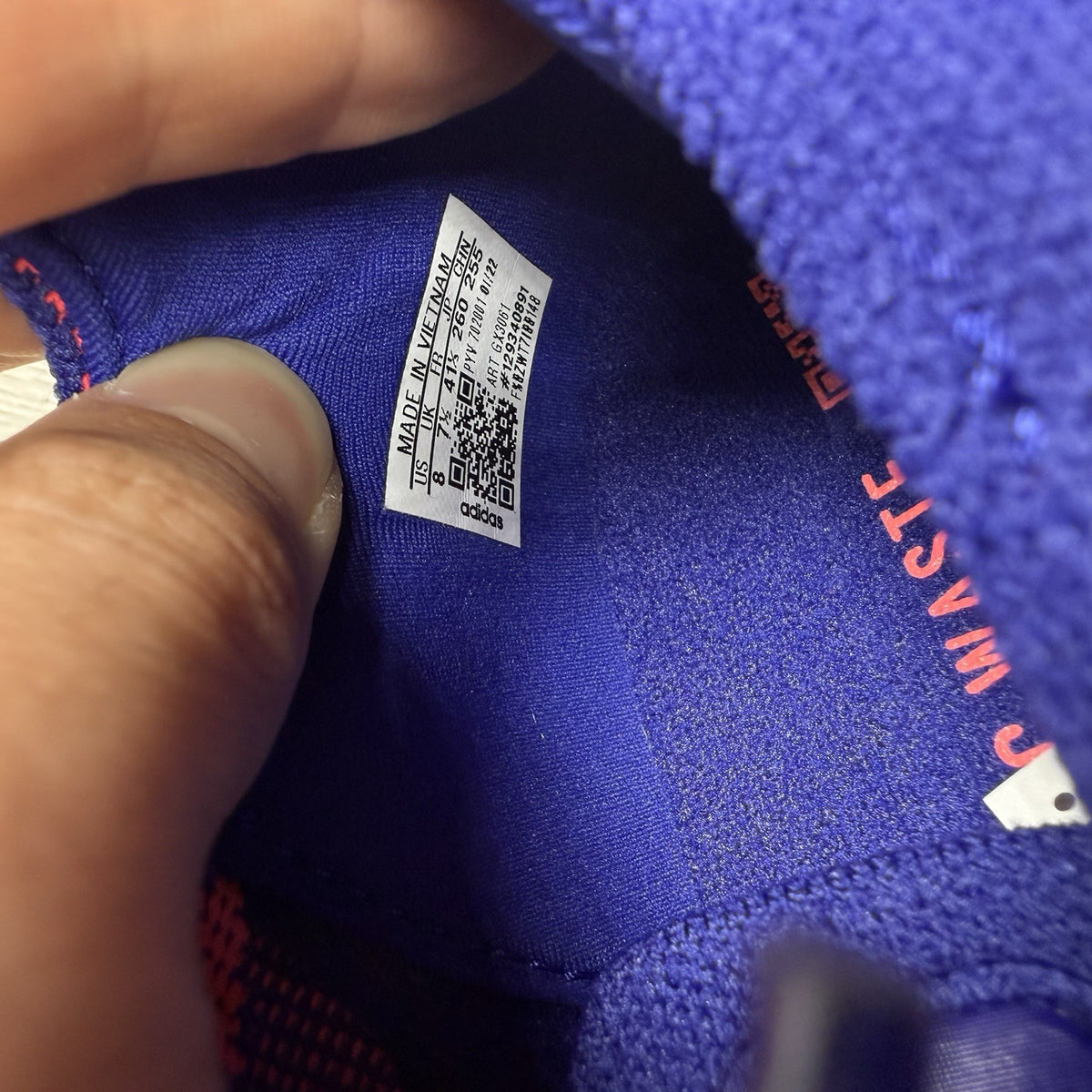 Adidas Ultra Boost 22 trainers in legacy indigo with turbo blue and white accents.