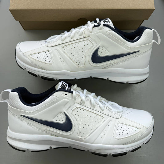 Nike T-Lite XI white trainers with navy and black accents, featuring logo detail.