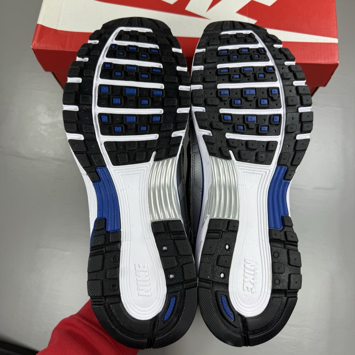 Nike P-6000 trainers white with laser blue and silver accents, mesh material, logo detail.