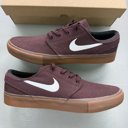 Nike SB Stefan Janoski burgundy trainers with gum sole and white accents.