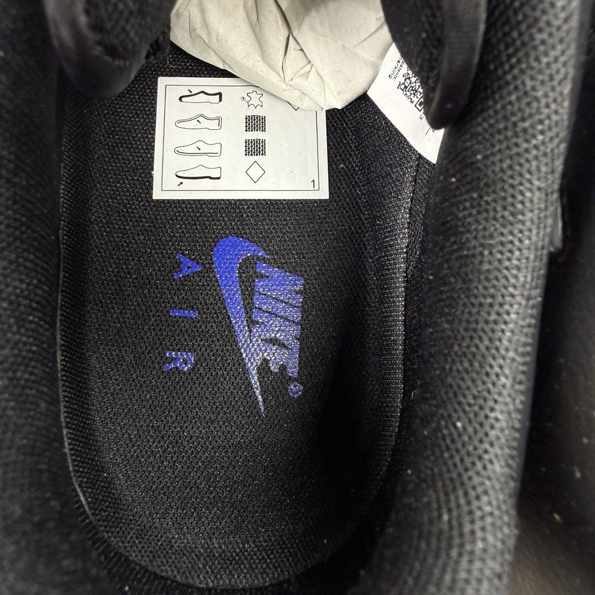 Nike black Air Force 1 Low trainers with jewel swoosh logo and grey accents.