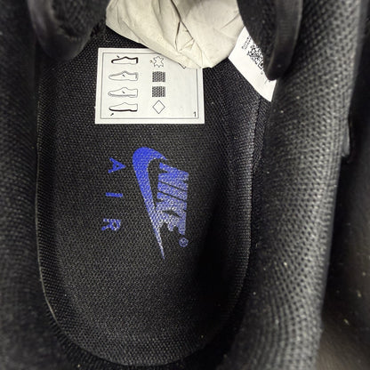 Nike black Air Force 1 Low trainers with jewel swoosh logo and grey accents.