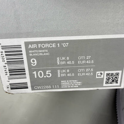Nike Air Force 1 '07 white trainers with classic silhouette and embossed logo.