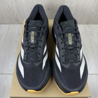 Adidas black trainers with white accents and distinctive Adizero branding.