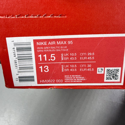 Nike running shoes orange with grey accents and distinctive logo detailing.