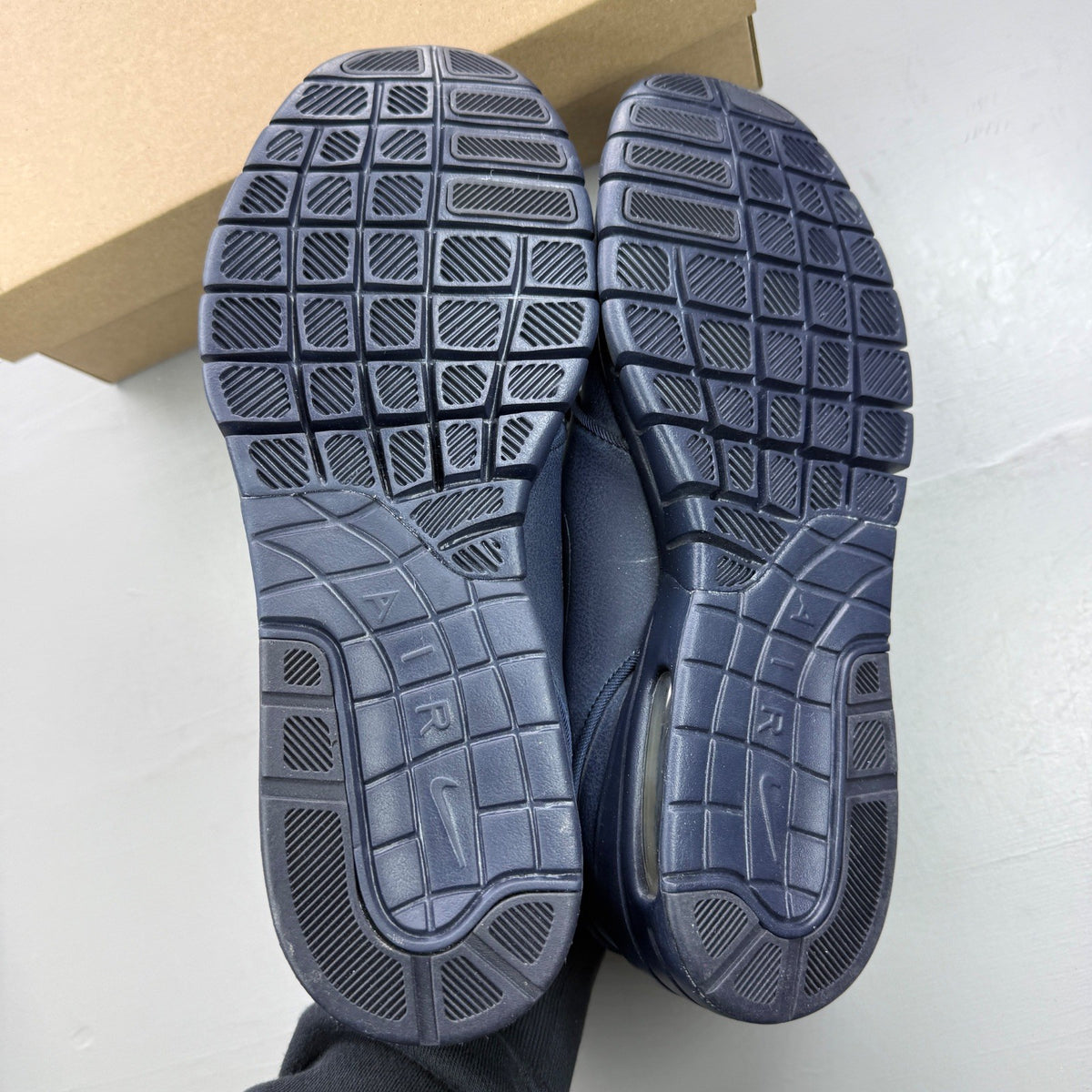 Nike deck shoes blue with logo detailing and cushioned sole design.