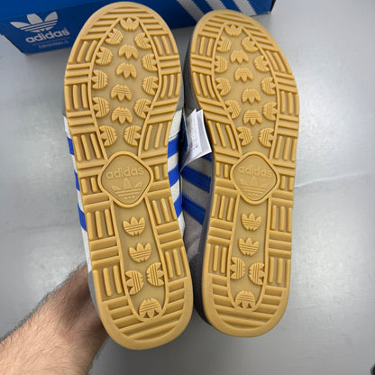 Adidas grey deck shoes with suede material and logo detail.