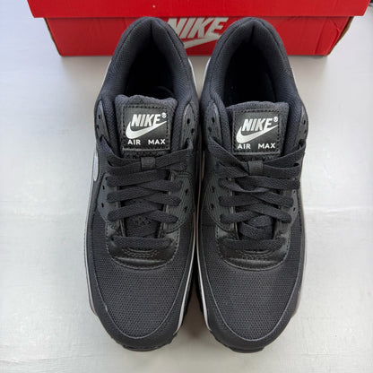 Nike Air Max 90 Premium black trainers with silver reflective accents and logo details.