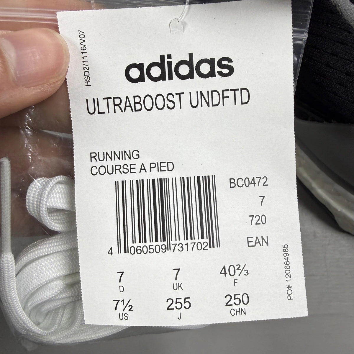 Adidas Ultra Boost black trainers with Undefeated logo and breathable mesh upper.