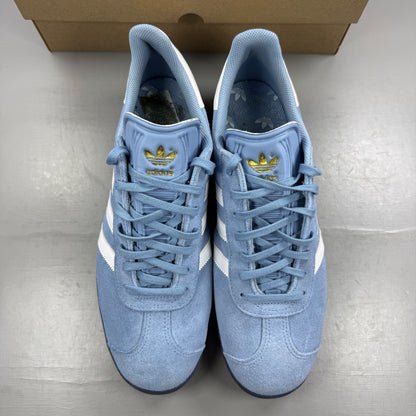 Adidas athletic shoes sky blue with white stripes and logo detail.