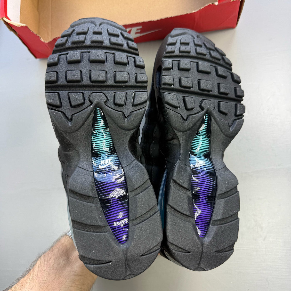 Nike Air Max 95 black trainers with big bubble design and multi-coloured accents.