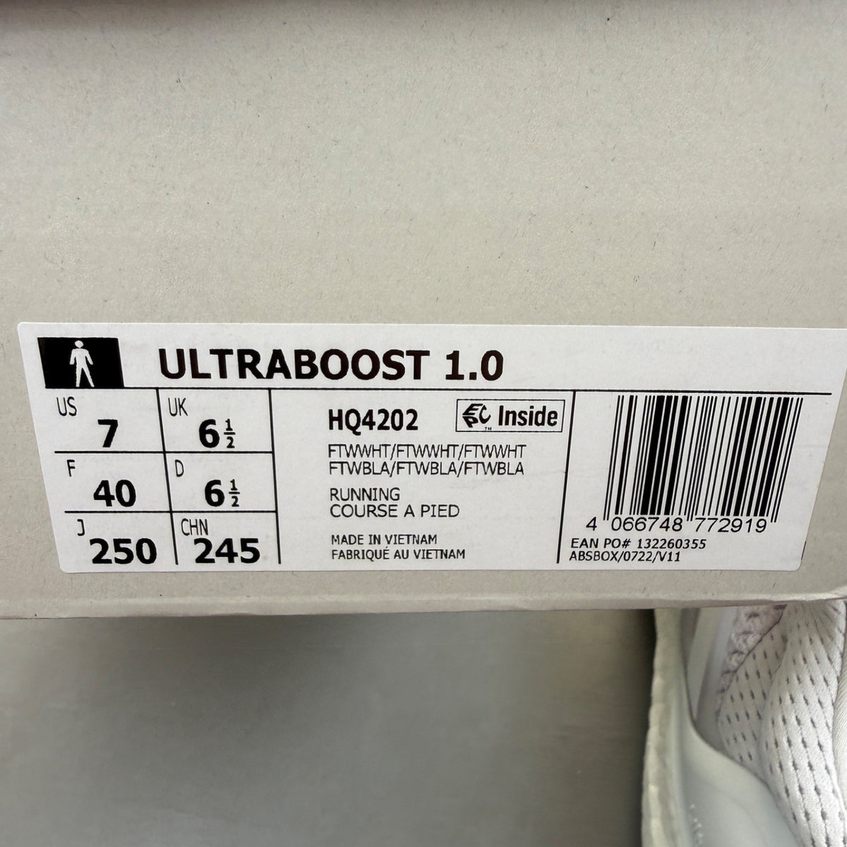 Adidas Ultra Boost 1.0 white running trainers with textured knit upper and signature three stripes.