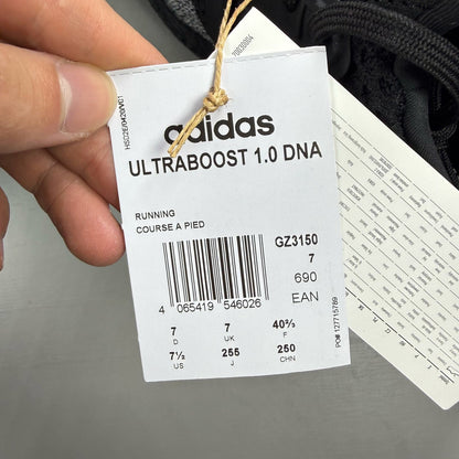 Adidas black Ultra Boost 1.0 trainers with core black and oreo toe design.