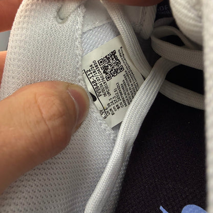 Nike Air Force 1 low white trainers with grey cement accents and logo detailing.