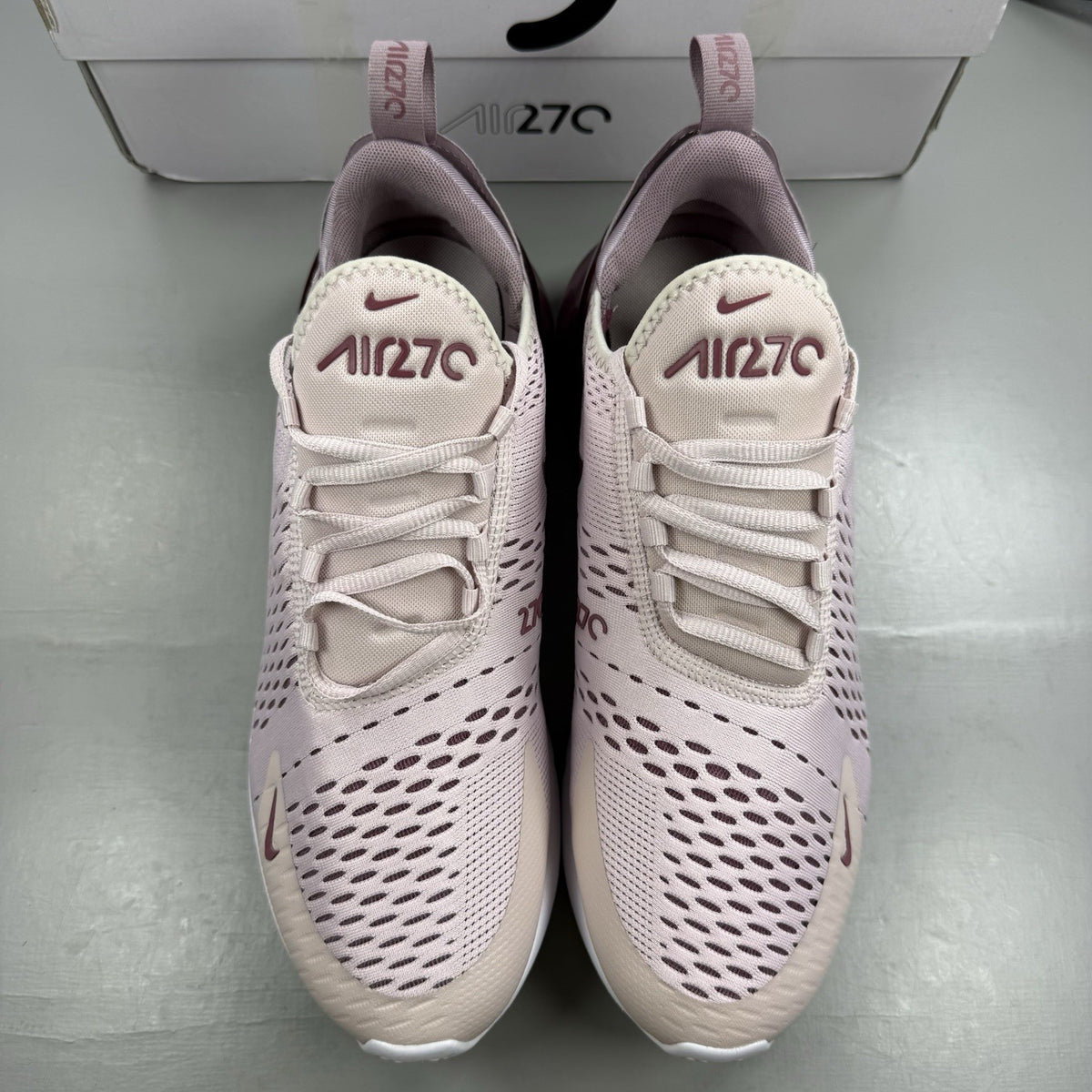 Nike Air Max 270 pink trainers with vintage wine accents and white sole.