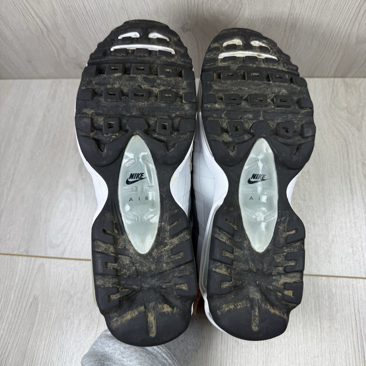 Nike Air Max 95 Ultra grey trainers with white accents and signature logo detailing.