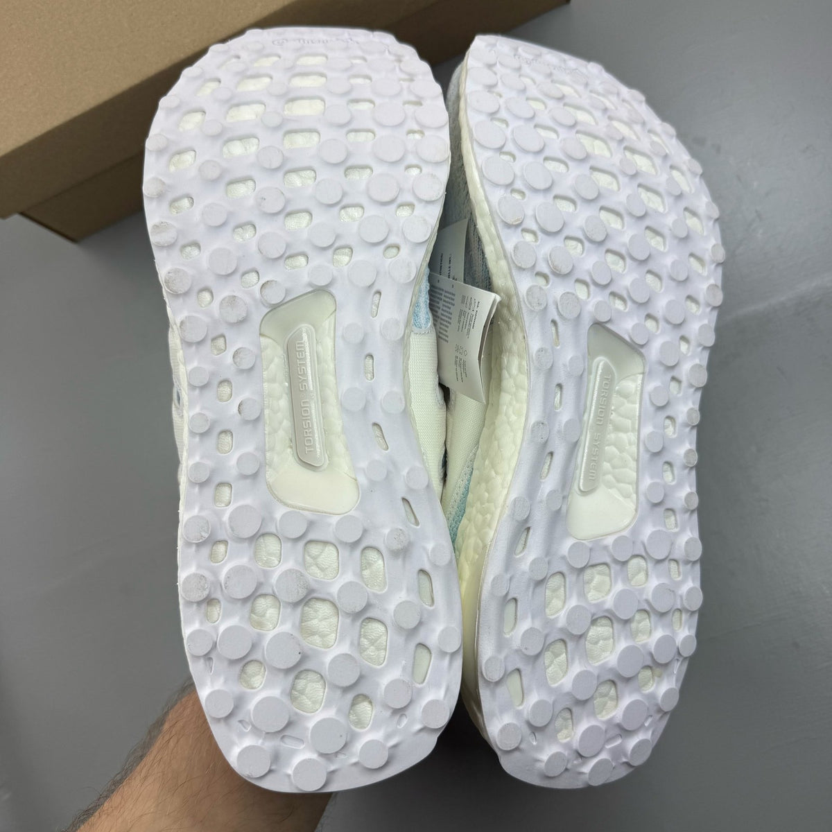 Adidas Ultra Boost 3.0 white trainers with Parley logo and breathable mesh upper.