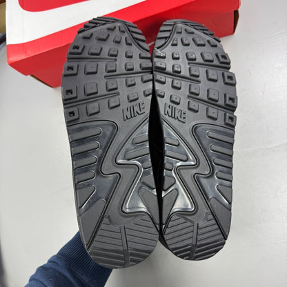 Nike athletic shoes black leather with Air Max branding and textured design.